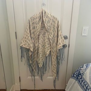 Triangle shawl with blue threaded fringe